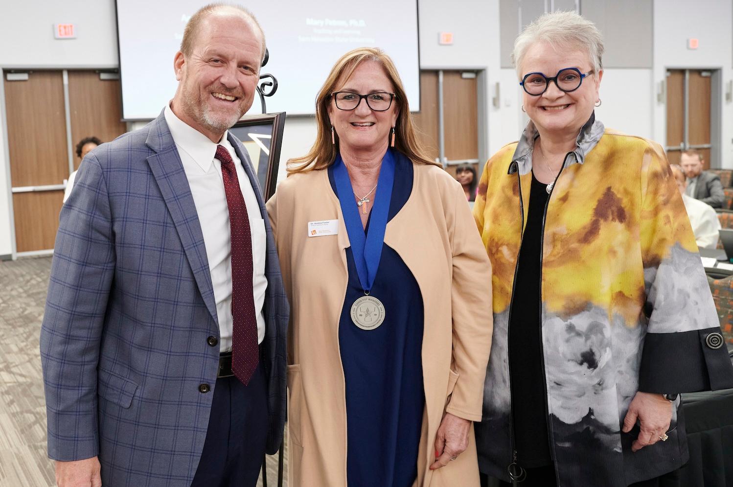 From left: Regent Stephen Lee, Andrea Foster and University President Alisa White